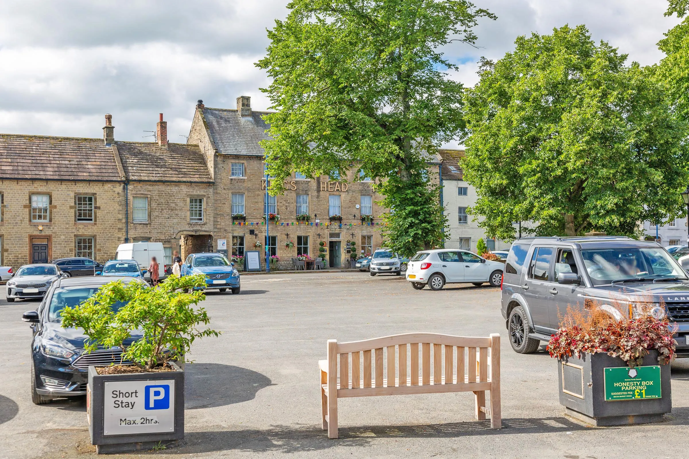 The wide cobbled market square at the heart of Masham, seen from above