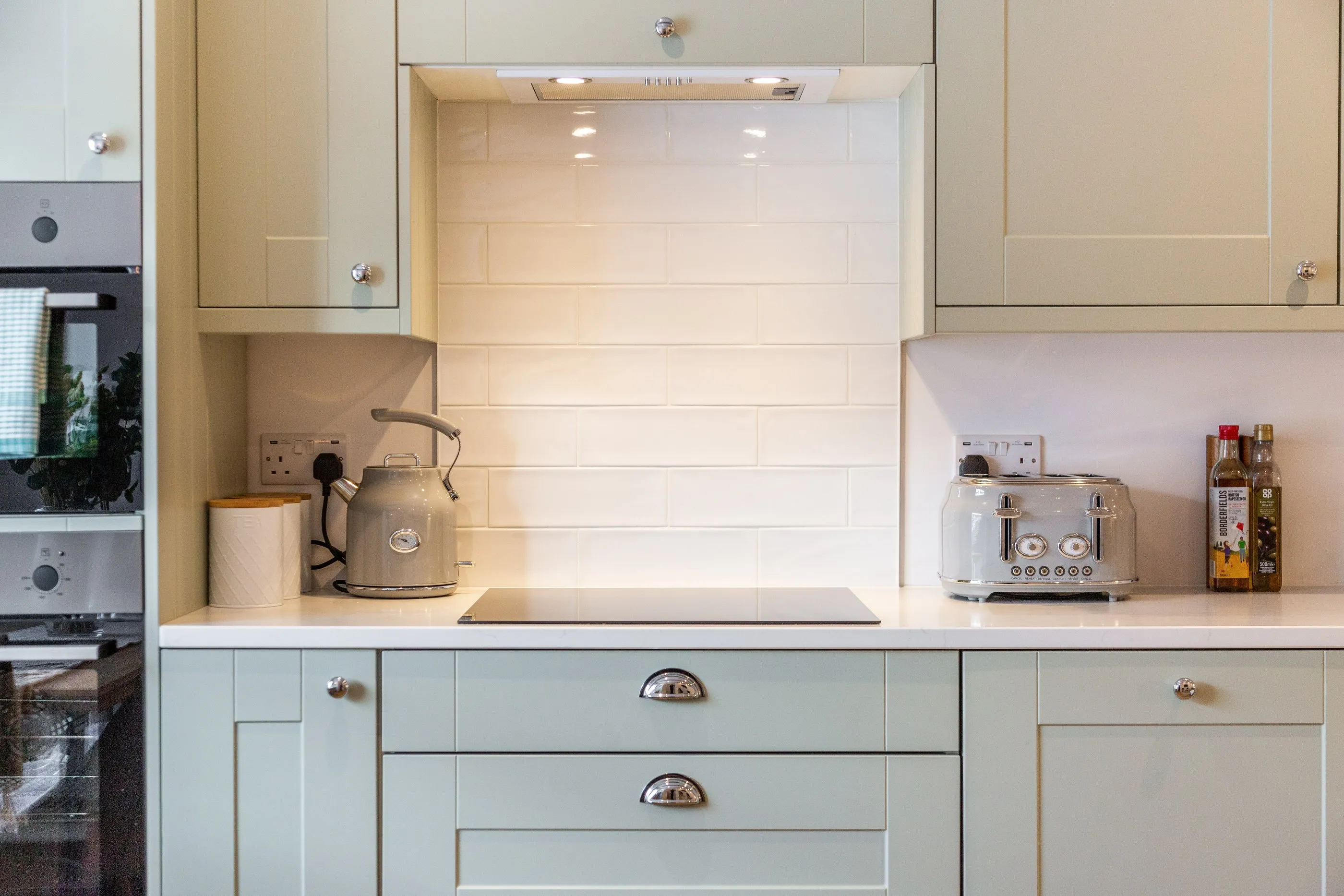 Retro kettle and toaster on a white quartz worktop
