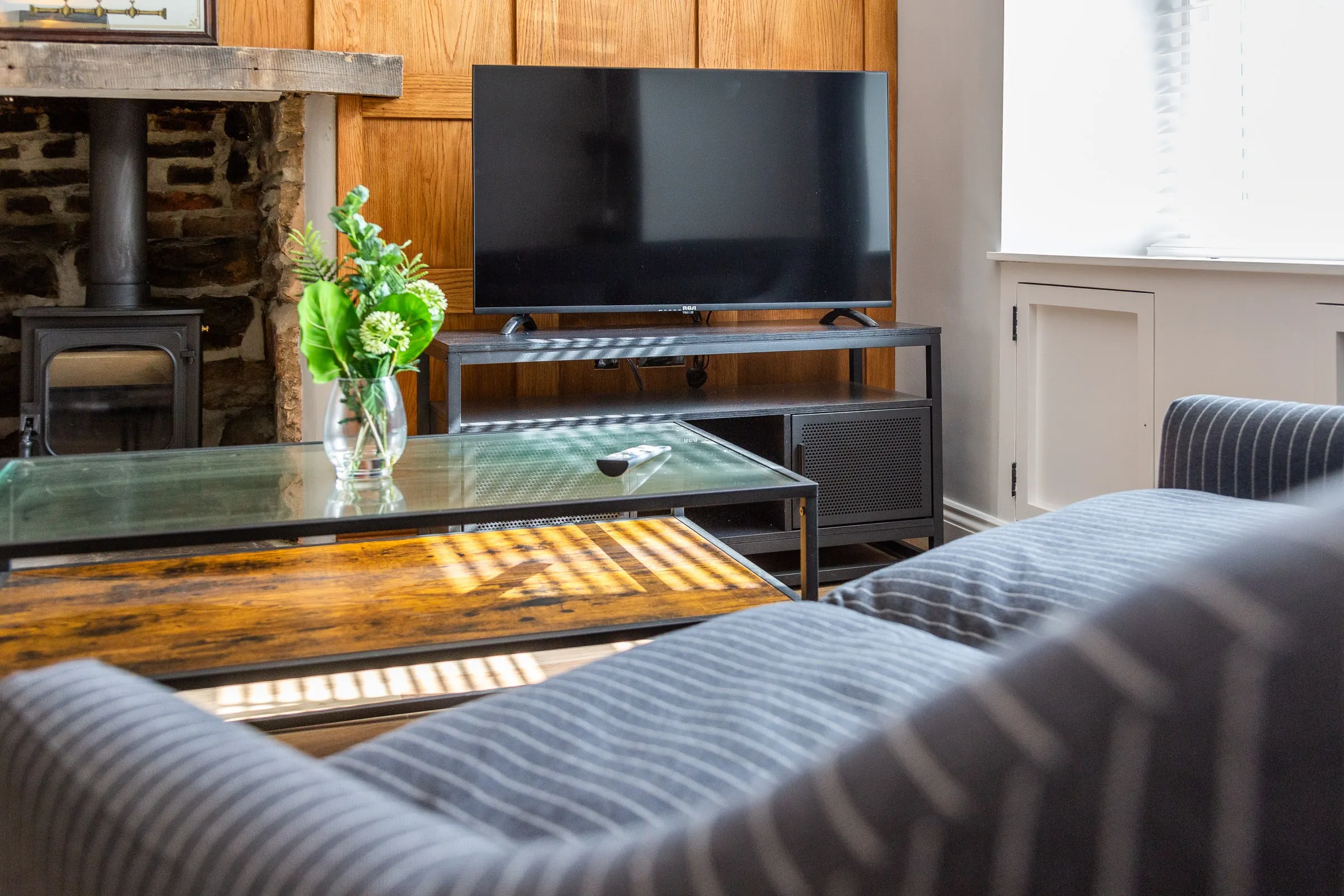 Sitting room with the wood burner and sofa