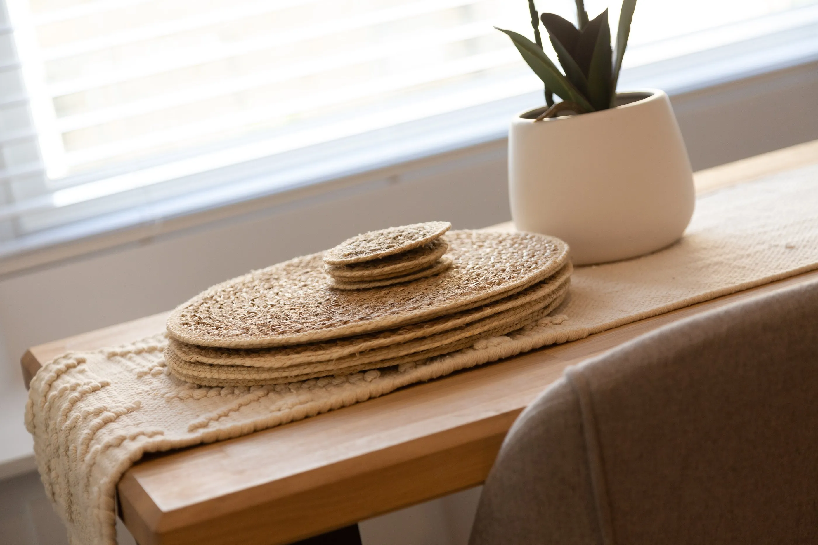Woven placemats on the oak dining table