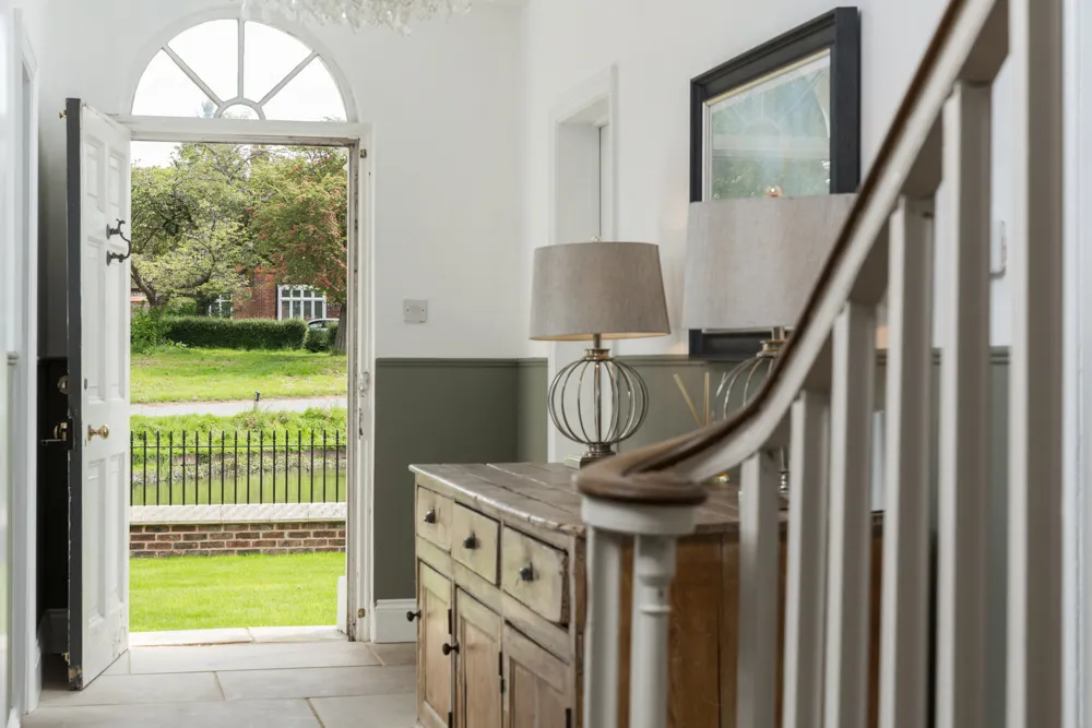 Entrance hall with fanlight door open to the green
