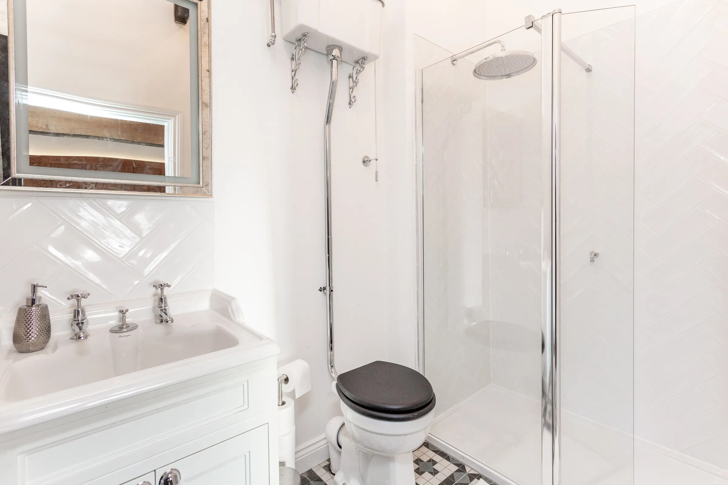 Shower room with rainfall shower and traditional high-level cistern