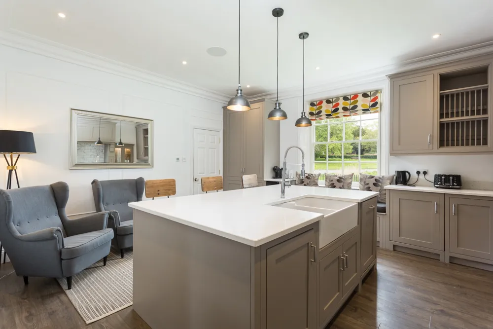 Kitchen island and window seat looking out to the village green